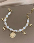 Elegant Pearl & Shell Charm Bracelet